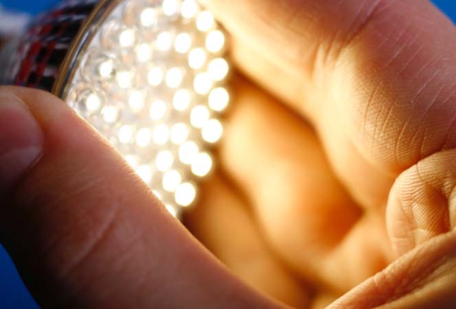 A hand holding an LED light
